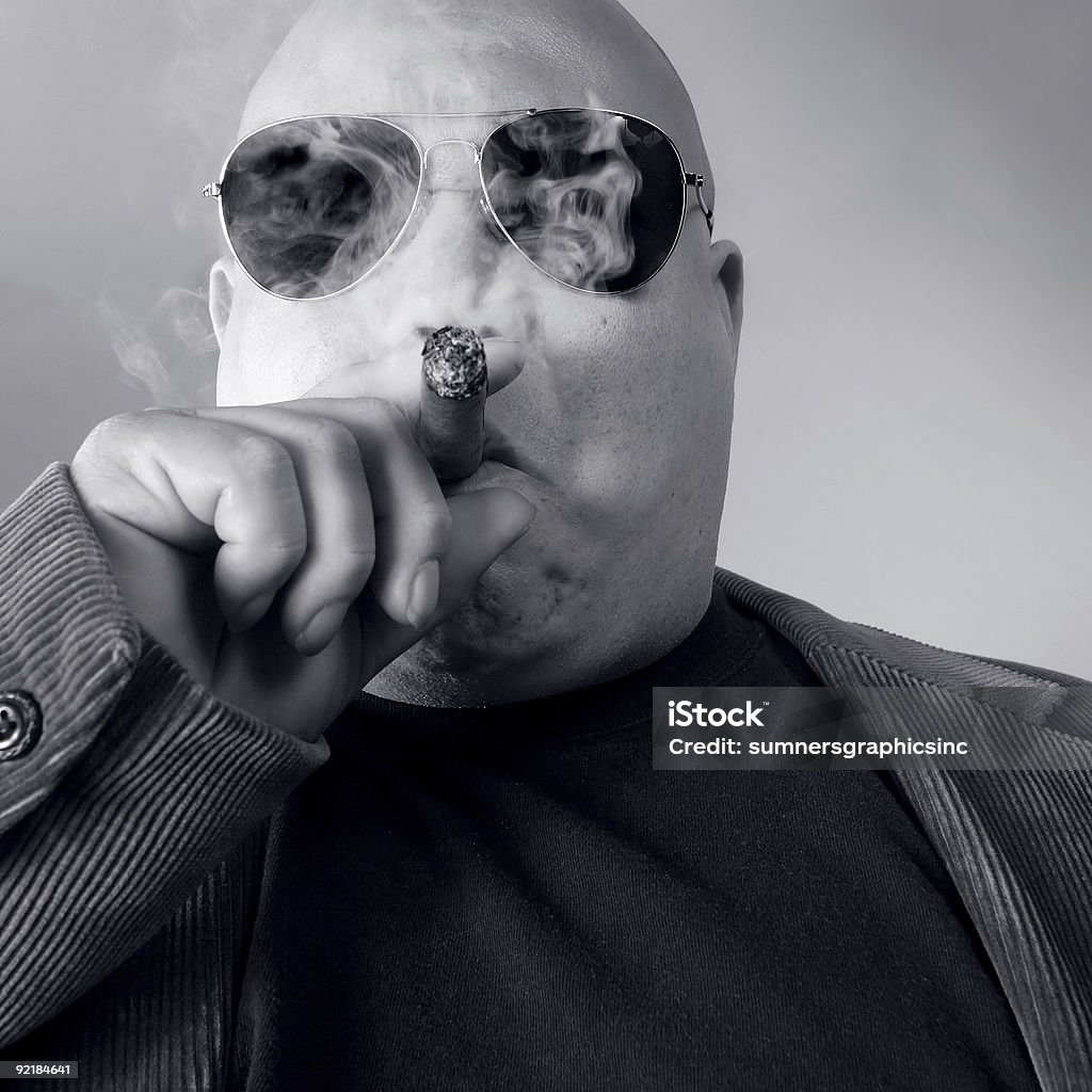 Big tough boss wearing sunglasses and smoking a cigar The big Boss, Head Honcho, Top Dog...   Loan Shark Stock Photo