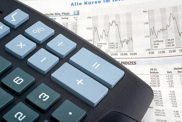 calculator on a financial newspaper  dealing room photos stock pictures, royalty-free photos & images
