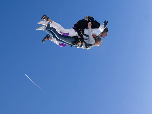 のロイヤリティフリーストックフォト。タンデムスカイダイビング - skydiving parachute parachuting taking the plunge ストックフォトと画像
