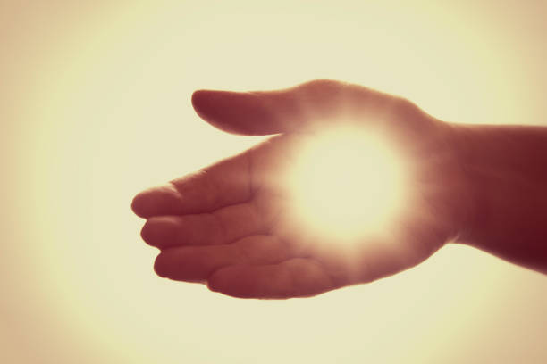 istock The Hand of Jesus in the Light 921855590