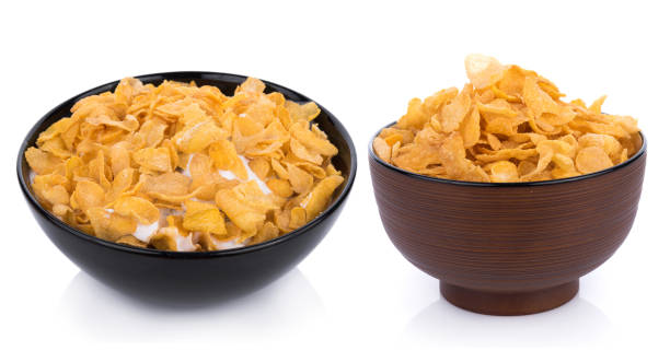 istock Corn flakes with milk in bowl isolated on white 921856922