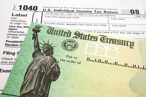 istock Income Tax Form and Refund Check 92186336