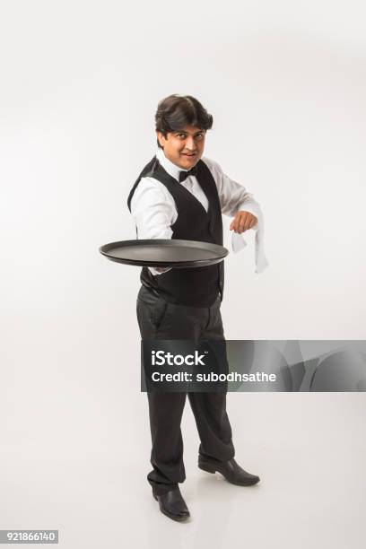 Asian Indian Waiter Or Bartender Isolated Over White Background Selective Focus Stock Photo - Download Image Now