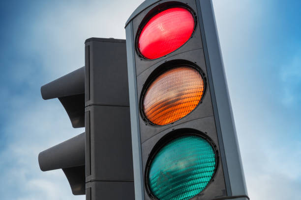 istock Urban traffic lights over blue cloudy sky 921869688