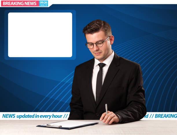 istock Television reporter telling breaking news at his studio desk with copy space 921876088