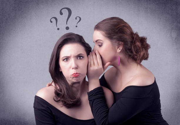 istock girl telling secret things to her girlfriend 921878724