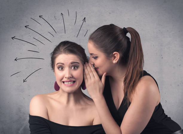 istock girl telling secret things to her girlfriend 921878802
