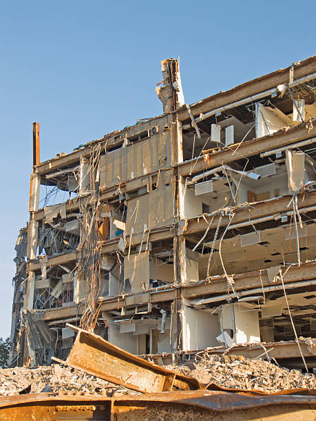 Building demolition vertical stock photo