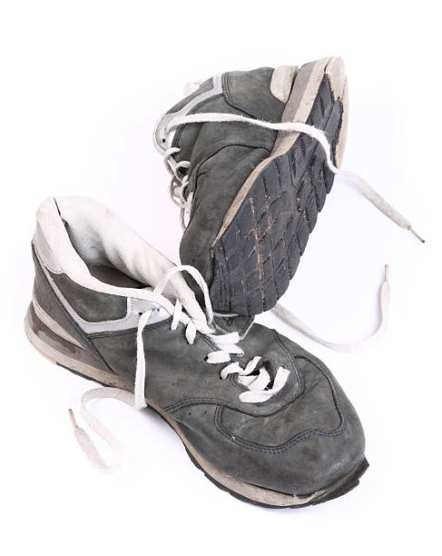 istock Old grungy Running Shoes isolated on white background 92188584