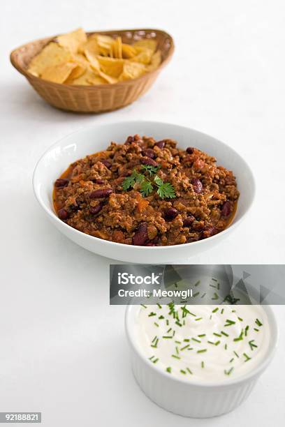 Chilli Tortillas And Sour Cream On White Stock Photo - Download Image Now - Bean, Beef, Bowl