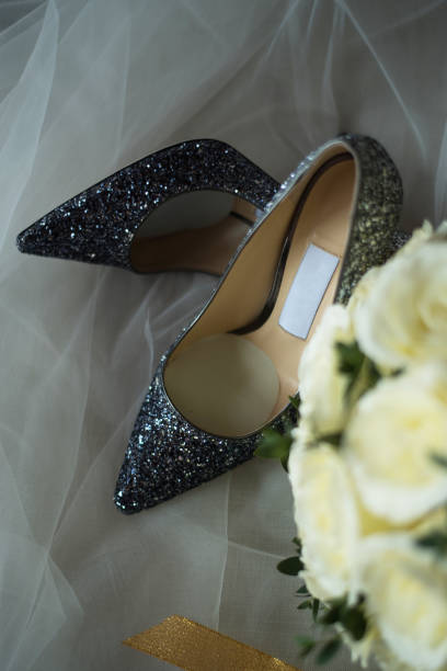 istock Elegant bridal shoes and a veil,selective focus. 921888376