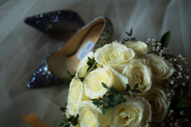 istock Elegant bridal shoes and a veil,selective focus. 921888748