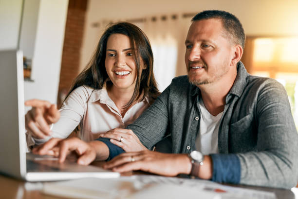 istock Helping his wife do some family planning 921890364