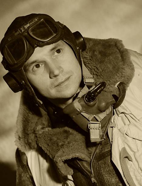 World War II RAF pilot with goggles Contemporary sepia toned portrait taken in vintage style. The model is wearing original WW2 RAF uniform and equipment.

 army soldier photos stock pictures, royalty-free photos & images