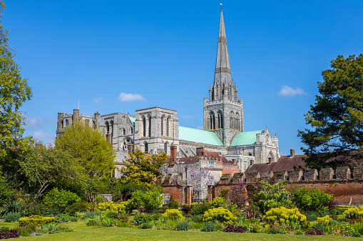 A beautiful panoramic view of Chichester Cathedral viewed from the Bishops Palace Gardens in the historic cathedral city of Chichester in West Sussex, UK.