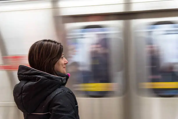 Photo of Woman Waiting for a Subway Train