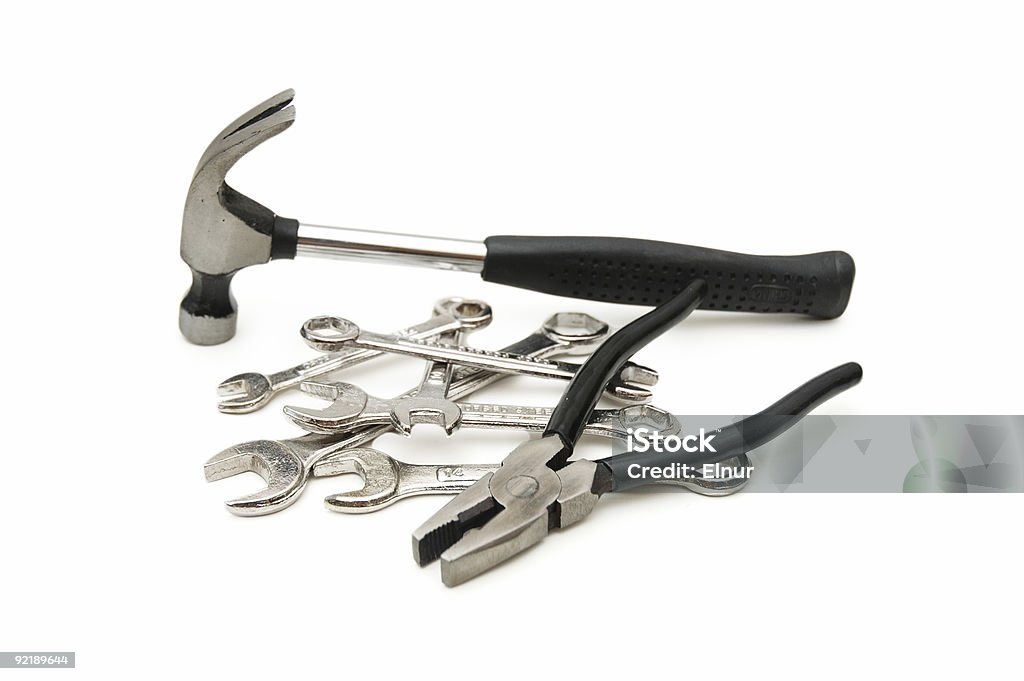 Various tools - hammer, spanners, pliers isolated on white  Blue-collar Worker Stock Photo