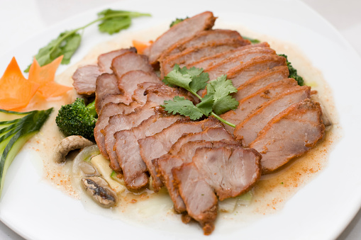 Sous vide pork tenderloin with black rice risotto and haricot verts.