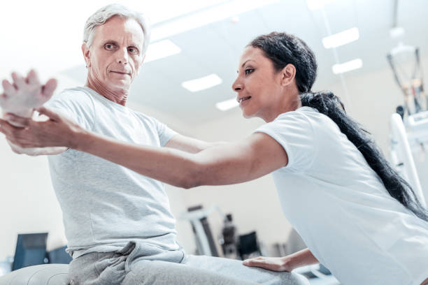istock Determined baby-boomer training his arms 921899214