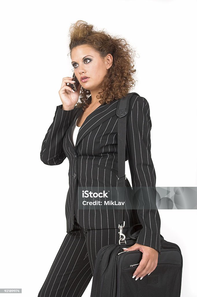 Biznes kobieta, rozmowy na jej telefon komórkowy - Zbiór zdjęć royalty-free (Aktówka)