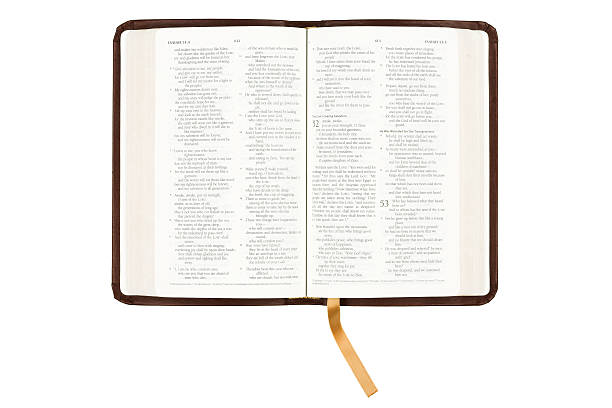 An opened bible with a yellow ribbon on another page stock photo
