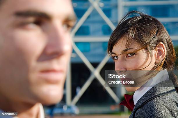 Woman Looking At A Man With Distrust Stock Photo - Download Image Now - Envy, Women, Suspicion