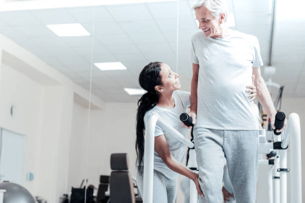 istock Joyful aged man training with a lovely woman 921902928