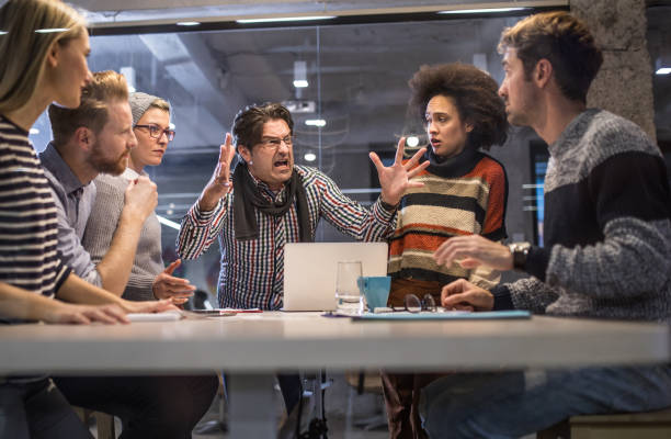 furious boss shouting at his team on a meeting in the office. - people in a row imagens e fotografias de stock