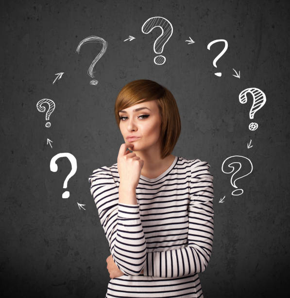 istock Young woman thinking with question mark circulation around her head 921903286