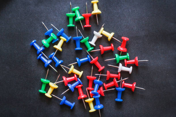istock Multicolored Stationery paper clips on a black background 921903692