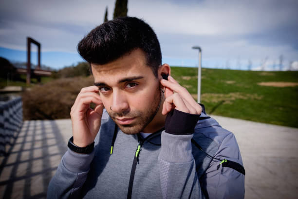 istock Young athletic man is preparing before running in a city park in winter. 921909426