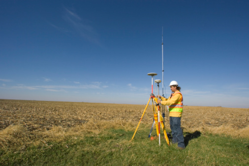 Land surveyor working with GPS unit.Click for more Land Surveying photos