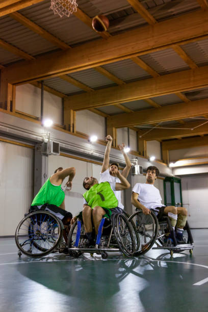 istock disabled sport men in action while playing indoor 921916246