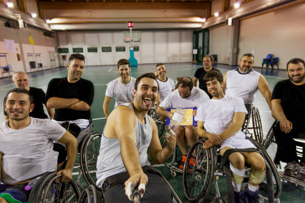 istock group of smiling disabled take a selfie 921916488