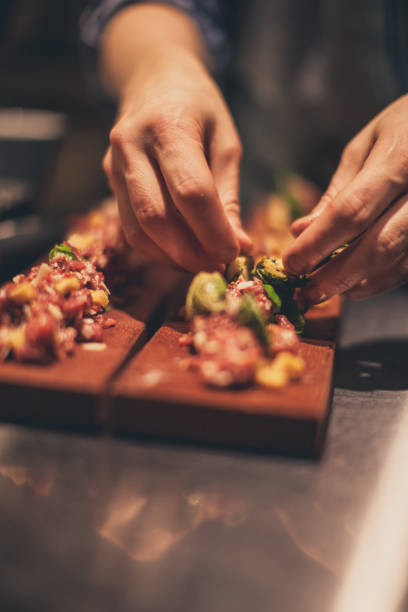 istock Chef At Work. Caterer Cooking In Commercial Kitchen 921916856