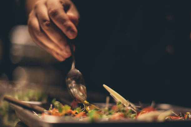 istock Chef At Work. Caterer Cooking In Commercial Kitchen 921916944