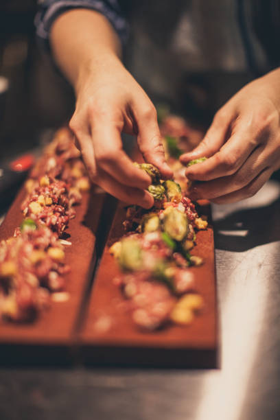 istock Chef At Work. Caterer Cooking In Commercial Kitchen 921917012