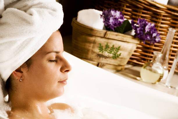 istock Woman lying in a bathtub with a towel 92192618