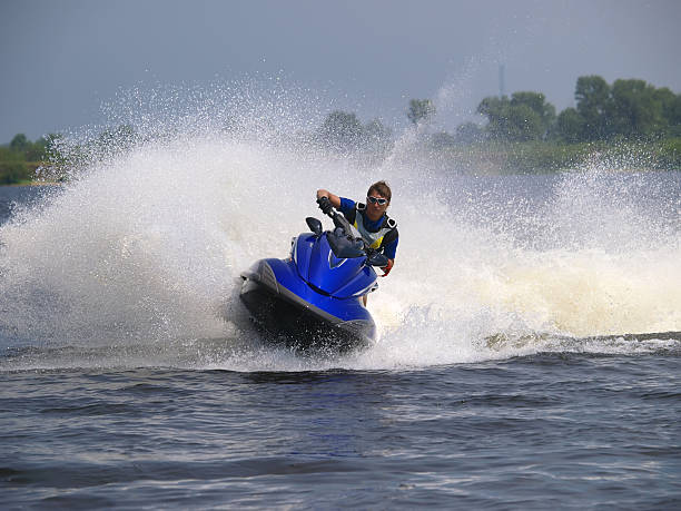 istock Man and WaveRunner on the water 92192667