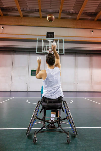 istock disabled sport men in action while playing indoor 921927956