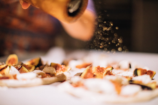 Chef preparing food in a commercial kitchen. Caterer, food service concept