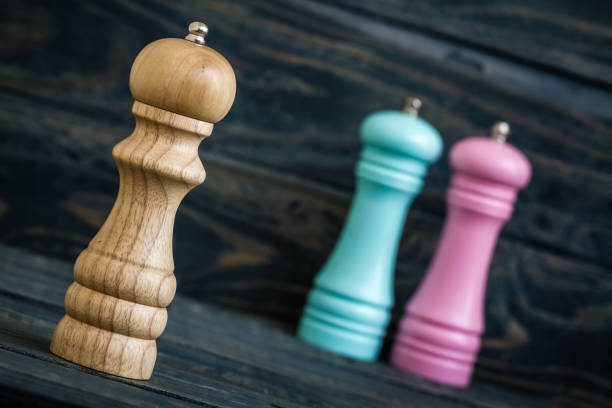 istock Colrful Peppermills on Blue Wooden Background 921937706
