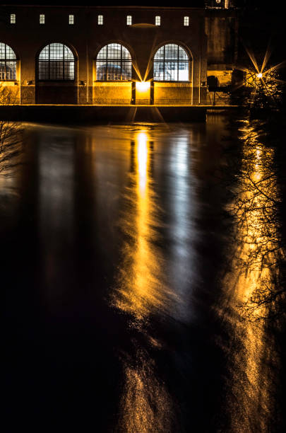 istock Water power plant at night 921946118