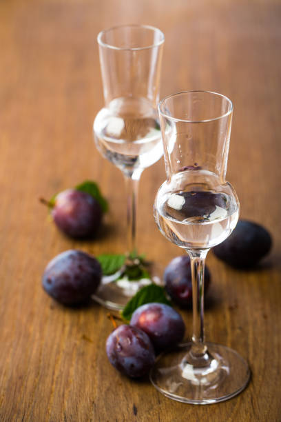 alcoholic drinks: 2 glasses of plum brandy - slivovitz imagens e fotografias de stock