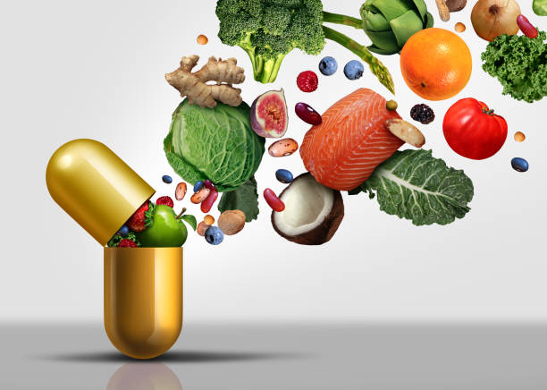 Vitamins Supplements Vitamins supplements as a capsule with fruit vegetables nuts and beans inside a nutrient pill as a natural medicine health treatment with 3D illustration elements. vitamin stock pictures, royalty-free photos & images