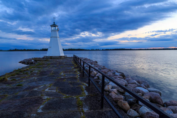 istock A pier with a little lighthouse  and fence 921950748