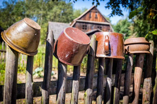 Clay pots on a fence