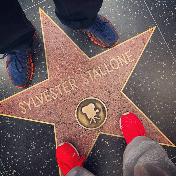 Los Angeles, USA - December 23, 2017:  Legs standing on Sylvester Stallone star on Hollywood Boulevard.