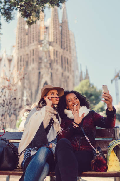 istock Friends in Barcelona making funny faces on video call 921973318