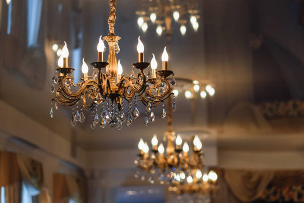 istock luxury vintage chandelier hanging on the ceiling with glowing lights 921976090